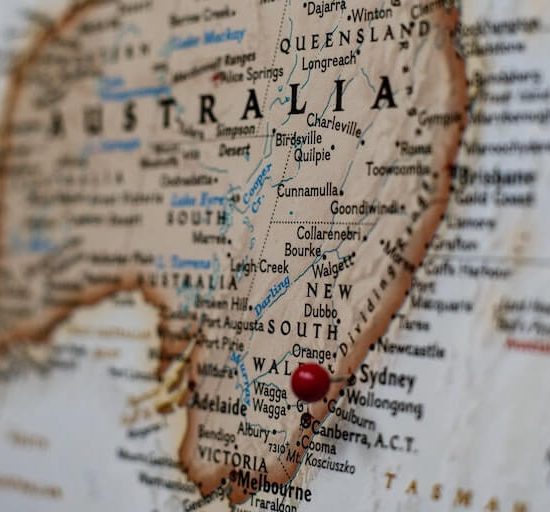 Australian Map with red pin in it.