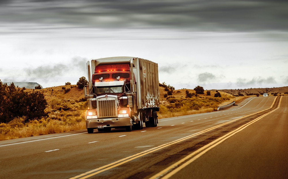 Truck driving on long road - Fuelchief article